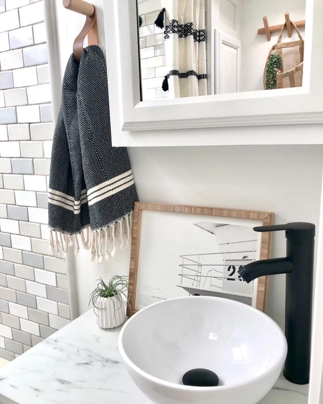 Renovated bathroom in RV with unique art display