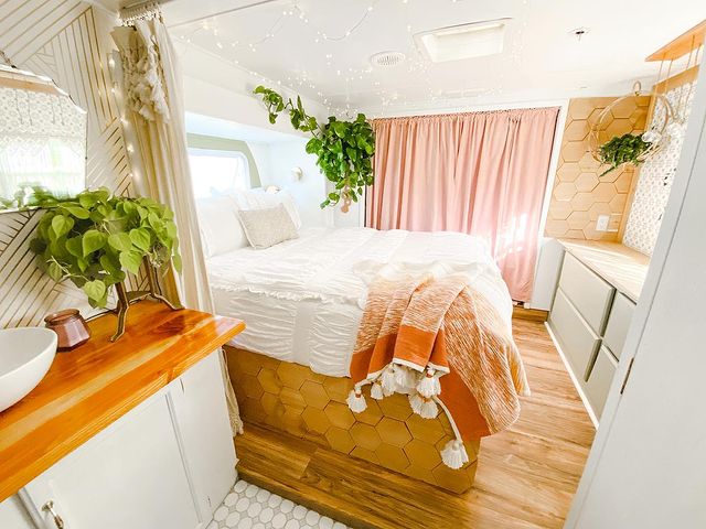 Renovated camper using curtains as a room divider