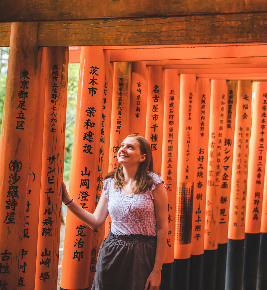 Walking through Fushimi Inari Taisha shrine on a family trip to Kyoto