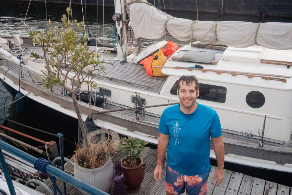 Standing in front of a houseboat rental in Amsterdam