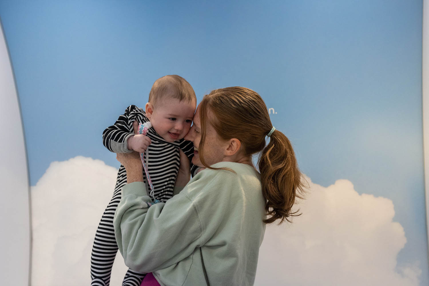 mom and baby using Mamava lactation pod at the airport