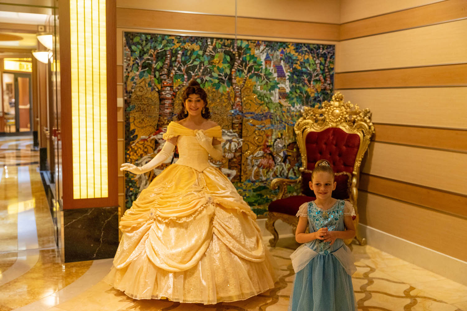 girl meeting princess belle after bibbidi bobbidi boutique